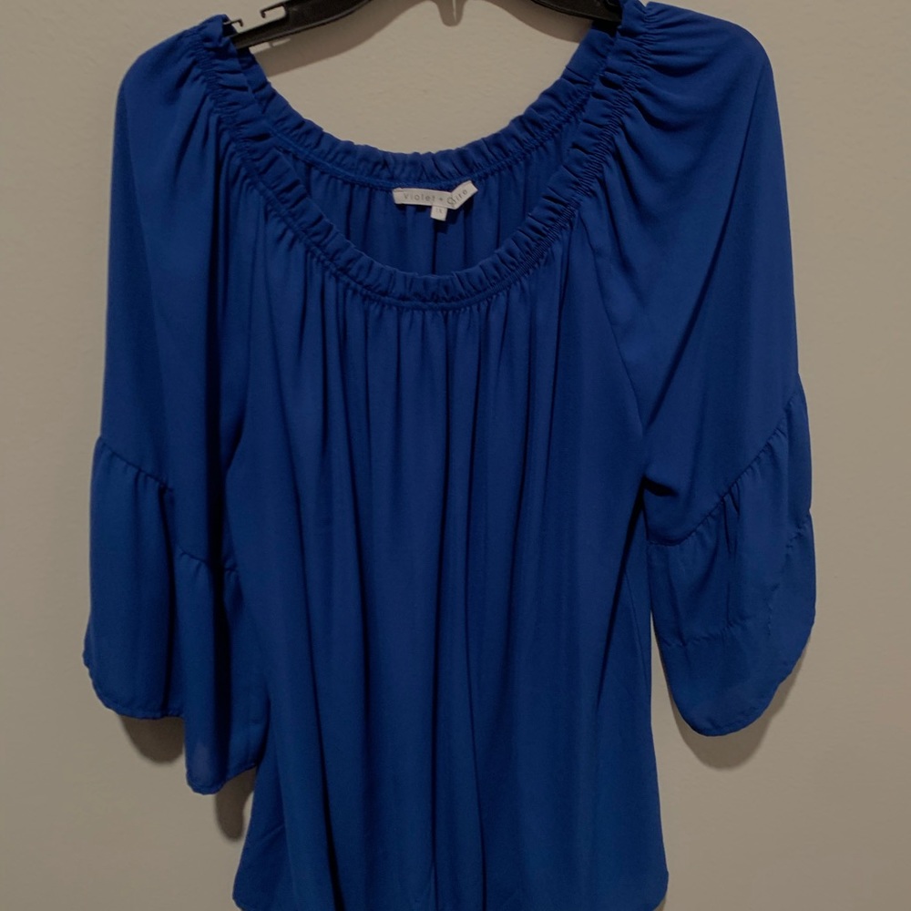 Blue off-shoulder top w/ ruffling at the neckline